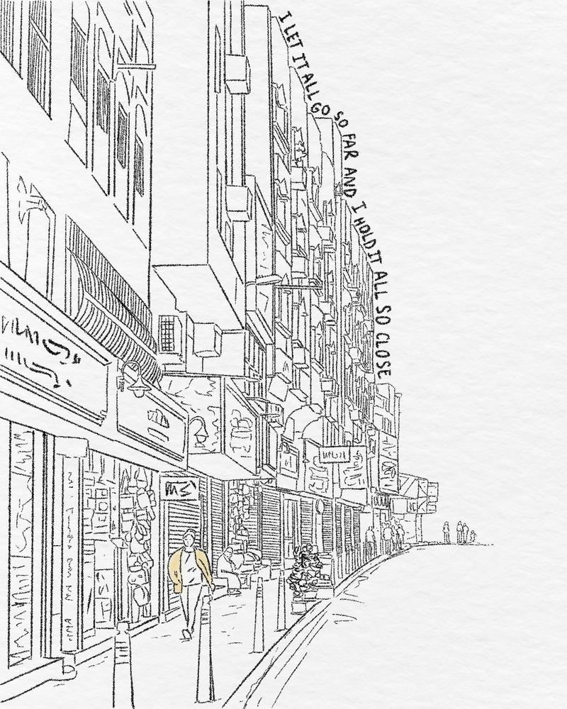 A line drawing of a street and buildings