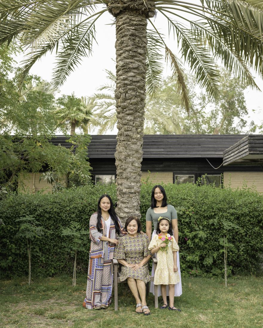 Documentary portrait of four women standing together