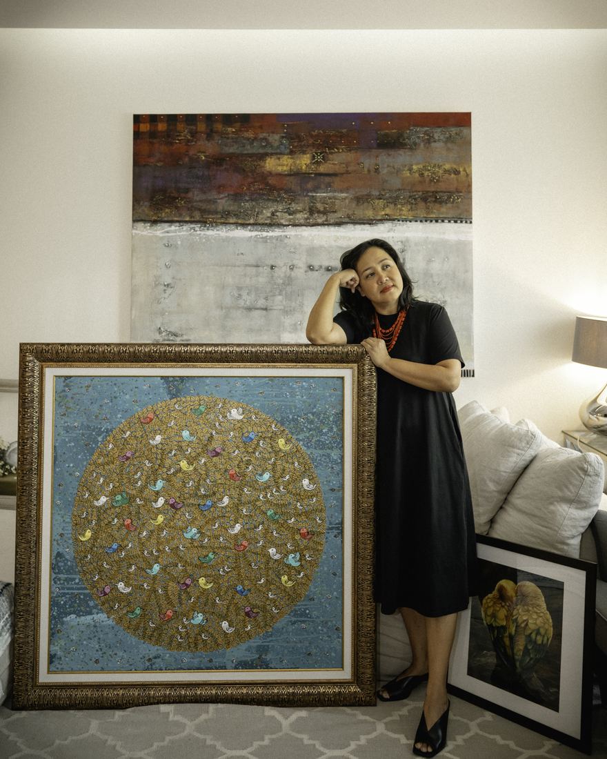 Documentary portrait of a woman with a framed work