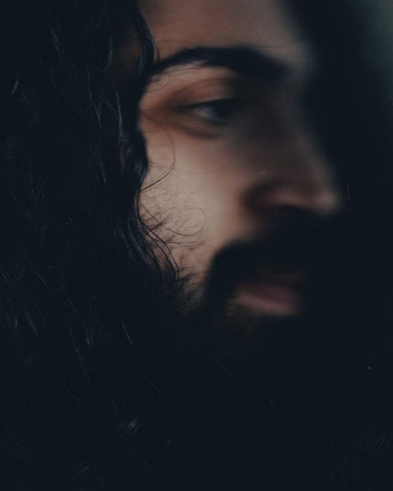 A dark, moody scanned film portrait